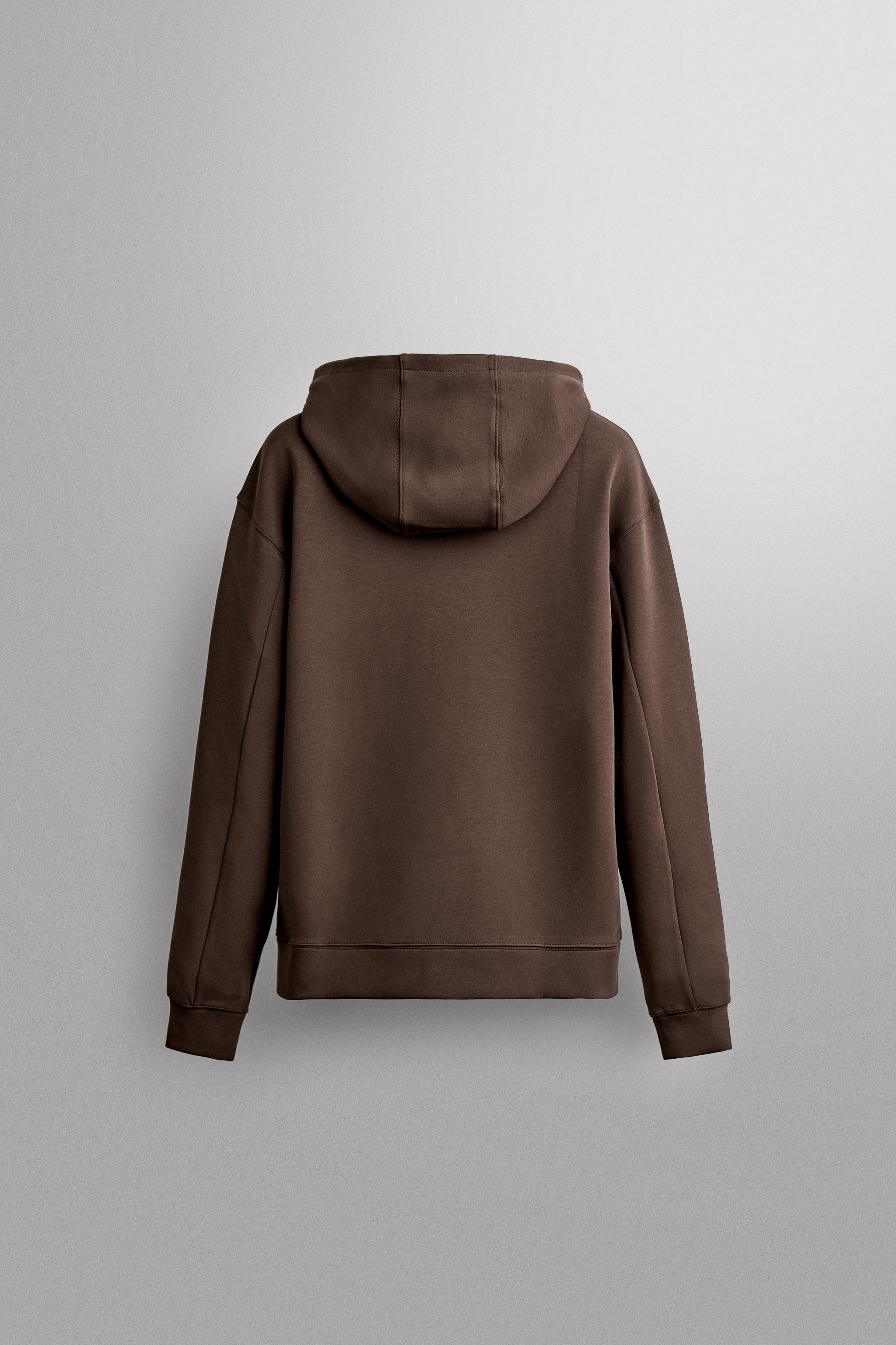 SWEAT TECHNIQUE À CAPUCHE